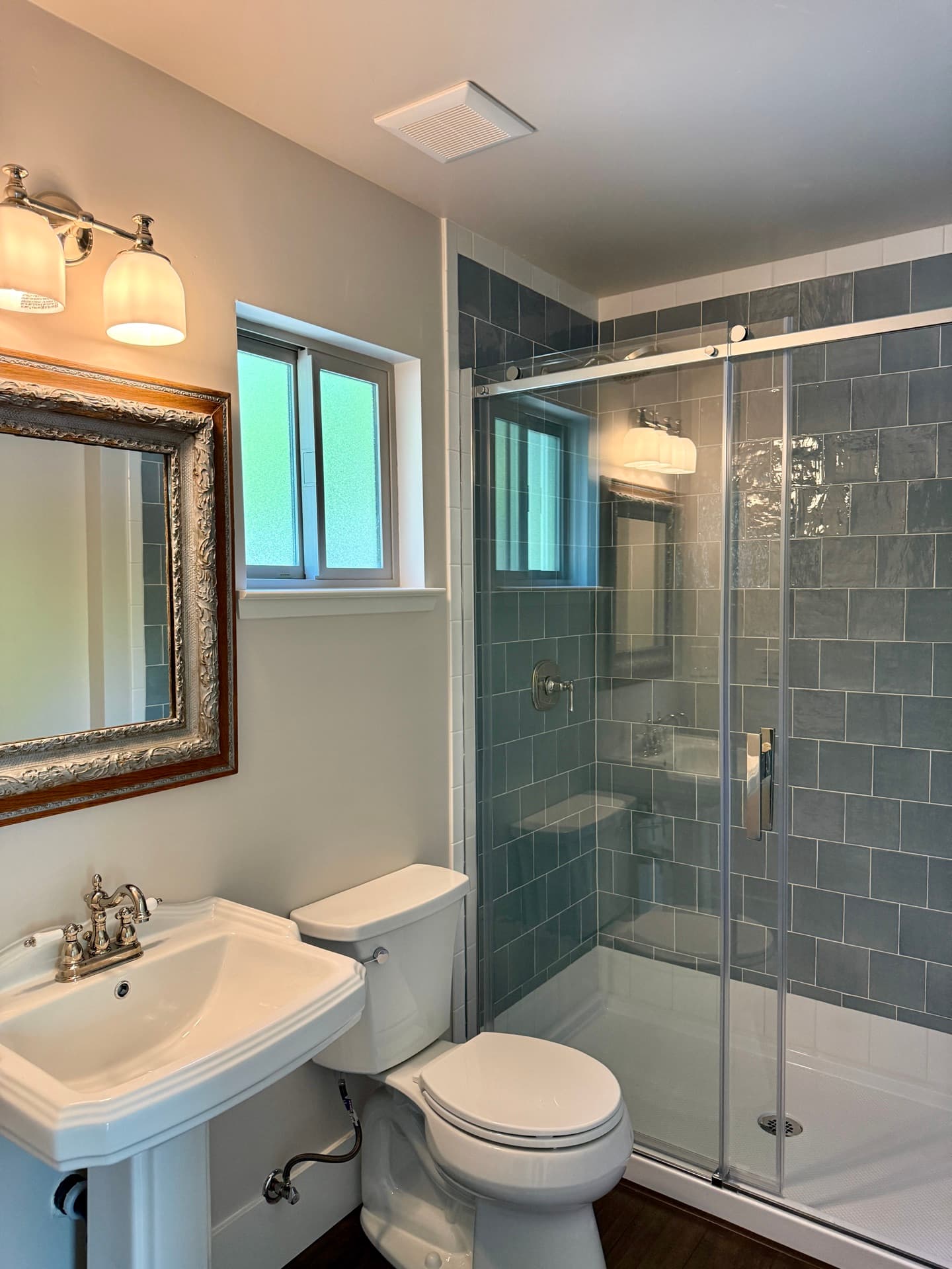 Roseville detached ADU — bathroom with sliding glass shower — gallery thumbnail 7
